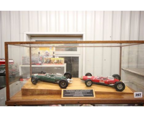 Two Schuco Lotus F1 cars in well presented case with plaque to front reading 1071 'Lotus Climax 33' Formula 1 by Schuco of We