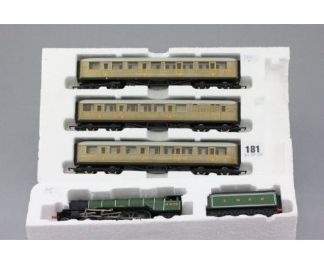 OO gauge Hornby Flying Scotsman engine and tender plus three Hornby carriages all in polystyrene