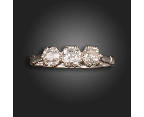 A diamond three-stone ring, set with three old cushion-shaped diamonds in white gold, size Q 1/2