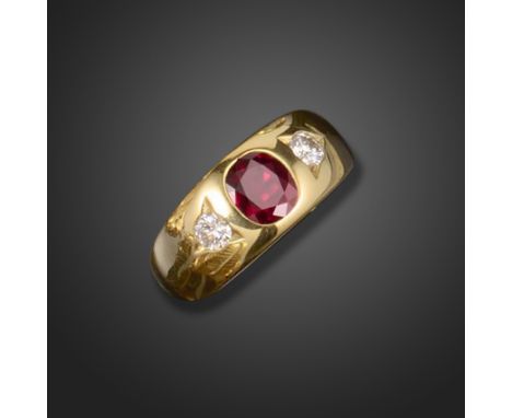 A ruby and diamond three stone gypsy ring, set with a cushion-shaped ruby with round brilliant cut diamonds in triangular set