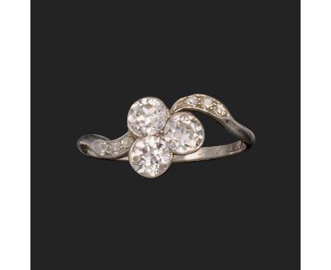 A diamond three-stone ring, millegrain-set with a trefoil of transitional round brilliant-cut diamonds each weighing approxim