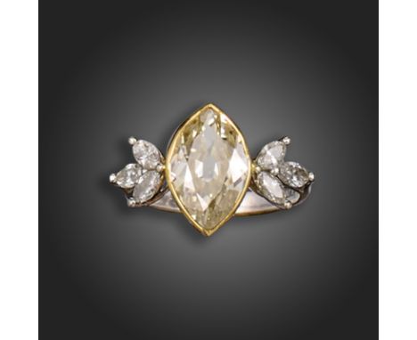 A diamond cluster ring, the marquise-shaped diamond weighs approximately 1.75cts, rubover-set in gold, with three marquise-sh