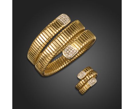 A gold bangle and ring, each formed with sprung and coiled bar links, rounded terminals pavé-set with round brilliant-cut dia