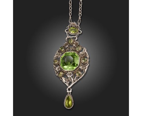 An Arts and Crafts silver and peridot pendant, early 20th century, collet-set with an octagonal step-cut peridot within a bor