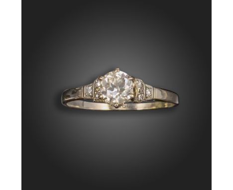 A diamond solitaire ring, the old circular-cut diamond weighs approximately 0.70cts, with three single-cut diamonds to each s