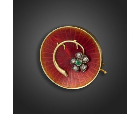 A diamond, emerald and enamel  brooch by Fabergé, the circular brooch applied with a flower, set with a centre emerald and fi