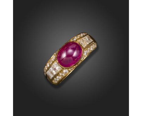 A ruby and diamond bombe ring, the cabochon ruby is rubover set, with princess-cut and round brilliant-cut diamonds to each s