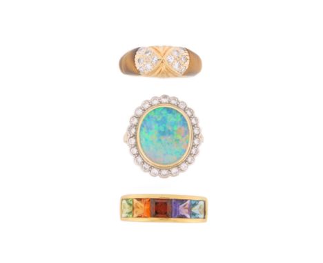 Three gem-set rings, a boulder opal and diamond cluster ring, set in gold, size L; a multi-coloured gem-set half hoop ring se