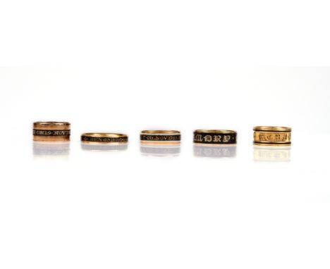 Five enamelled gold mourning rings, late 18th - 19th century, each with black enamel decoration, three with internal mourning