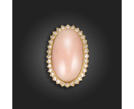 λ A coral and diamond cluster ring, the oval pink coral set within a surround of single-cut diamonds in gold, size K