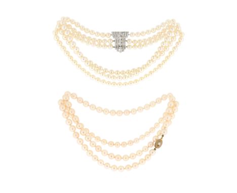 A three-row cultured pearl choker-length necklace, with an Art Deco platinum and white gold diamond-set clasp, set with gradu