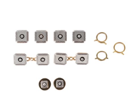 A set of early 20th century square-form dress cufflinks and studs, centred with a circular-cut diamond in a black onyx surrou