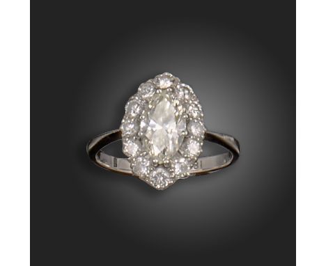 A marquise-shaped diamond cluster ring, the marquise-shaped diamond weighs approximately 0.85cts, set within a surround of ro