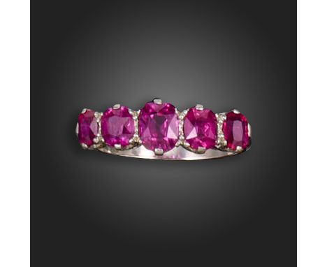 A ruby half-hoop ring, set with graduated cushion-shaped rubies in platinum, size M 1/2