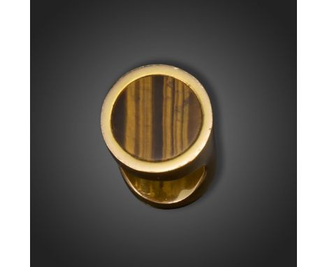 A tiger's eye gold ring by Larry, c.1970's, set with a circular tiger's eye disc in a cylindrical gold ring, size I approxima