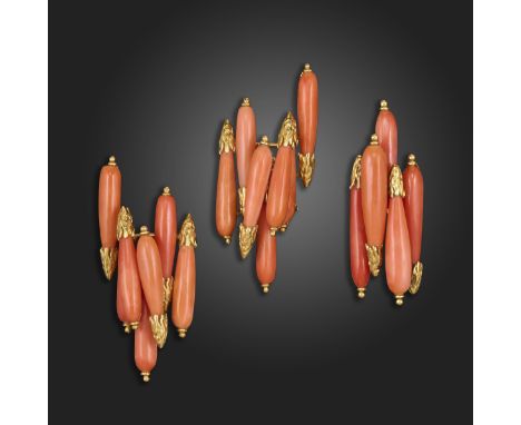 λ A coral-mounted gold ring and earrings by Sterlé, set with coral batons with textured gold terminals, each signed Sterlé Pa