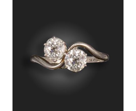 An early 20th century two-stone diamond crossover ring, set with two old circular-cut diamonds weighing approximately 0.50cts