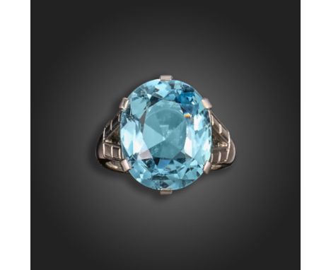 An aquamarine ring, the cushion-shaped aquamarine weighs approximately 11.50cts, claw-set in white gold with bifurcated shoul