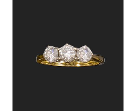 A diamond three-stone ring, the graduated round brilliant-cut diamonds weigh approximately 0.95cts total, set in 18ct gold, L