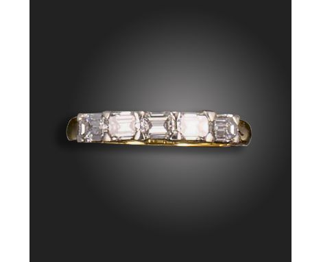 A diamond five-stone ring, set with five emerald-cut diamonds in two-colour gold, size N