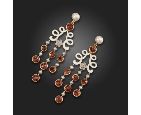 A pair of mandarin garnet, diamond and seed pearl drop earrings, suspending from a double scroll deaign with white enamel dec