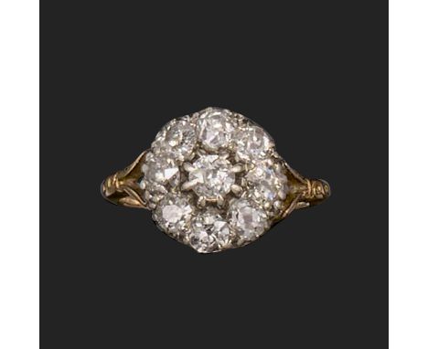 A 19th century diamond cluster ring, set with old circular-cut diamonds in silver on gold, scroll engraved bifurcated gold sh