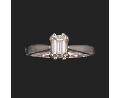 A diamond solitaire ring, set with a baguette-shaped diamond weighing approximately 0.30cts, set in 18ct white gold, London h