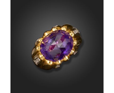 An amethyst and diamond ring by Sabbadini, the fluted gold ring set with round brilliant-cut diamonds to the shoulders and a 