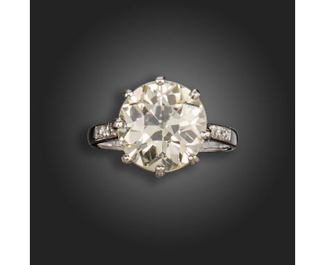 A diamond solitaire ring, the transitional round brilliant-cut diamond weighs 4.48cts, set with three single-cut diamonds to 