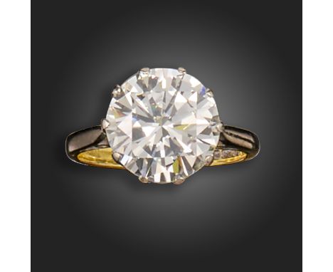 A diamond solitaire ring, the round brilliant-cut diamond weighing 4.72cts, set in platinum and gold, size K 1/2 The diamond 