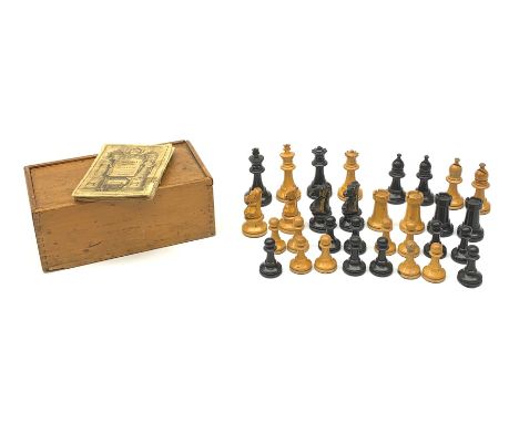 Unmarked Staunton pattern boxwood and ebonised chess set, king H8.5cm, in wooden box with sliding lid; and a disbound copy of