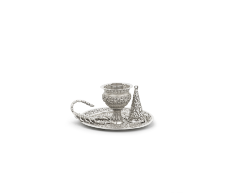 A repoussé silver chamber stick and candle snuffer by Oomersi Mawji Bhuj, 19th Centuryof squat globular form with everted rim