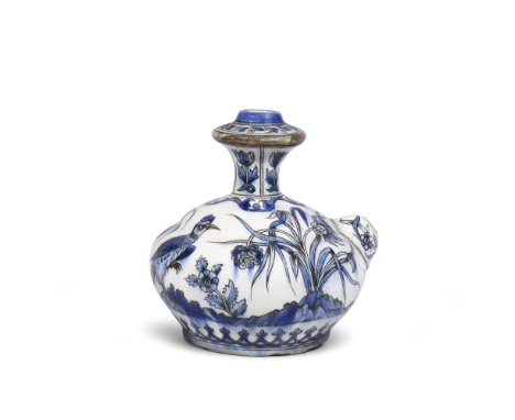 A Safavid style underglaze-painted pottery kendi Qajar Persia, 19th Centuryof compressed globular form with truncated conical