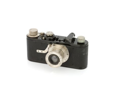 A Leica Ia Camera, 1930, black, serial no. 35105, with Leitz Elmar f/3.5 50mm lens, nickel, body, VG, shutter/film advance no