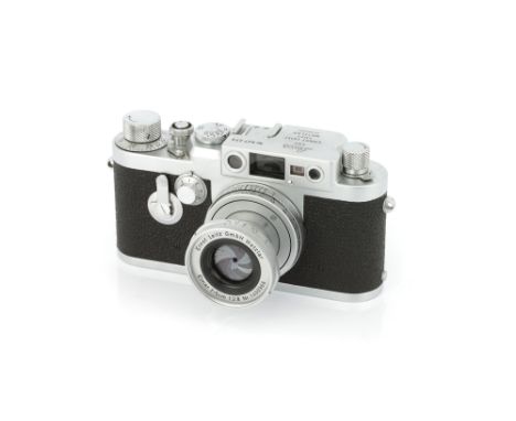 A Leica IIIg Rangefinder Camera, 1956, chrome, serial no. 827273, with Leitz Elmar f/2.8 50mm lens, 1956, chrome, serial no. 