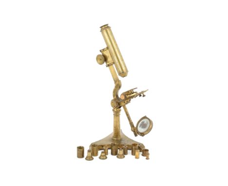 An Early Achromatic Compound Brass Microscope, English, c.1850, unsigned, standing on a heavy 'Y' shaped base with architectu