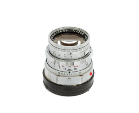 A Leitz Summicron Dual-Range f/2 50mm Lens, 1962, with ocular attachment, chrome, serial no. 1956177, body, VG, elements, VG,