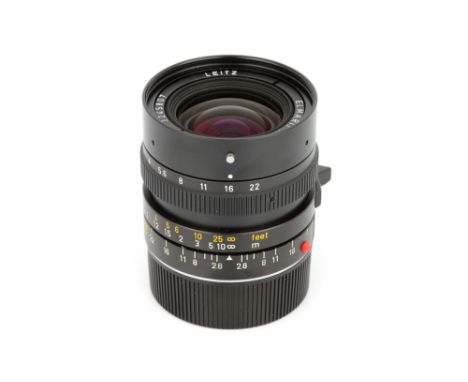 A Leitz Elmarit-M f/2.8 28mm Lens, 1982, black, serial no. 3245807, body, E, elements, VG, some internal haze, with E49 UVa f