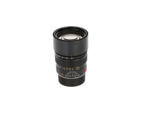 A Leitz Summicron-M f/2 90mm Lens, 1984, black, serial no. 3298606, body, VG, elements, E, with E55 UVa filter, caps, warrant