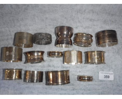 A PAIR OF SILVER ENGINE-TURNED NAPKIN RINGS and a collection of similar napkin rings (a lot)