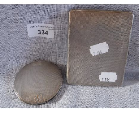 A SILVER CIGARETTE CASE and a silver compact (2)
