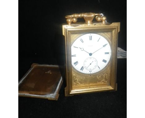 VULLIAMY: A SMALL GILT-CASED TRAVELLING CLOCK with watch movement stamped 'Vulliamy M Z A I London' and signed enamel dial