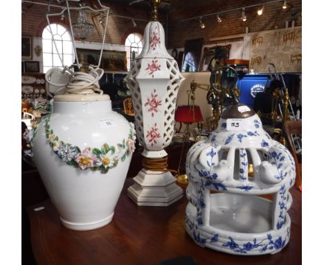 A CONTINENTAL PORCELAIN VASE with applied floral swags and one other table lamp and a Chinese style glazed pottery bird-cage 