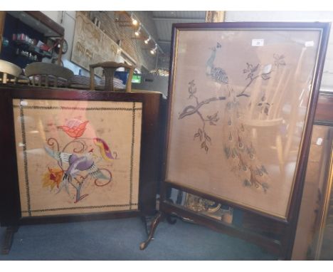 AN EDWARDIAN FIRE SCREEN with needlework, depicting a peacock and another similar