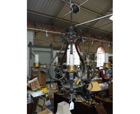 A WROUGHT-IRON FIVE BRANCH CHANDELIER with acanthus leaf decoration