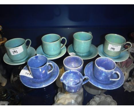 RUSKIN WARE: A SET OF FOUR GREEN GLAZED CUPS with saucers and similar mauve glazed teawares