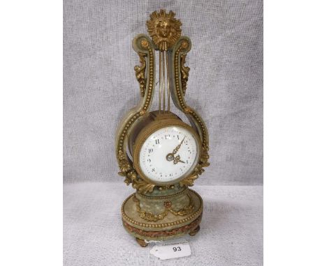 A FRENCH GREEN MARBLE AND BRASS MOUNTED MANTEL TIMEPIECE with enamel and painted dial, retailers mark 'MAPLE & Co Made in Fra