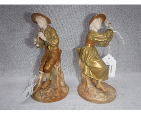 A PAIR OF ROYAL WORCESTER FIGURES OF A BOY PLAYING PIPES and his companion 