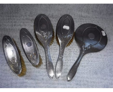 A SILVER-BACKED DRESSING TABLE SET with engine-turned decoration