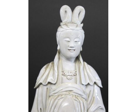 LARGE CHINESE BLANC DE CHINE FIGURE probably 19thc, an unsually large blanc de chine figure standing on a scroll base. Some d